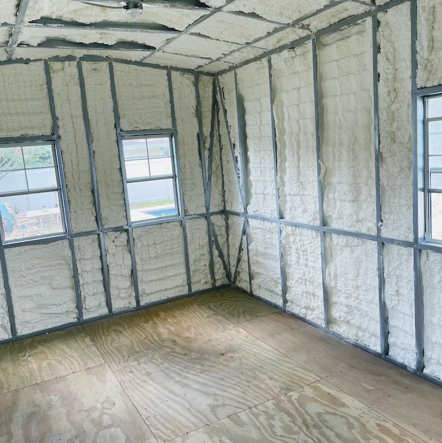 Closed-cell spray foam insulation applied to wall cavities in a residential project in Alden